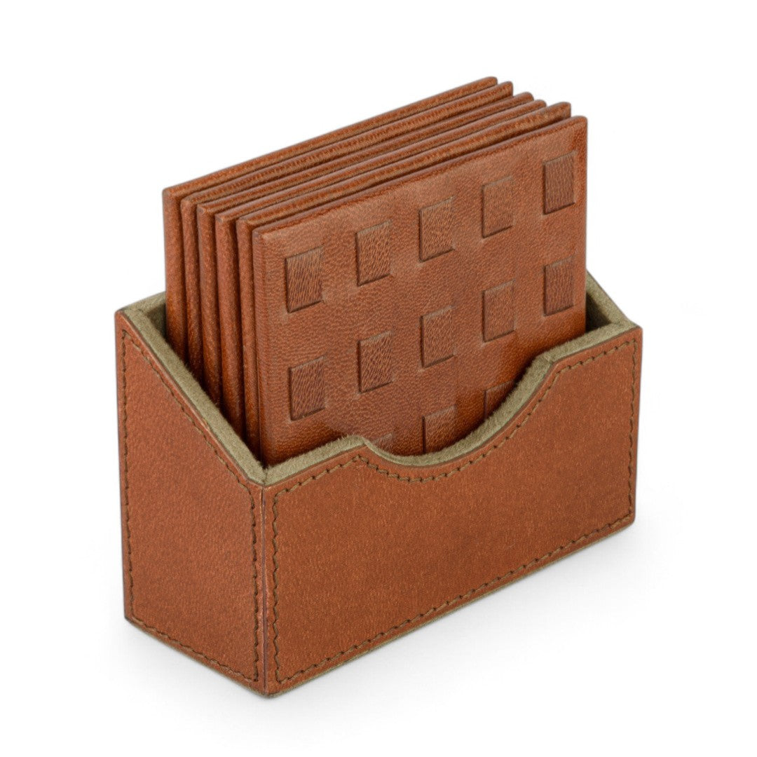 Brown leather coasters with a holder on a white background