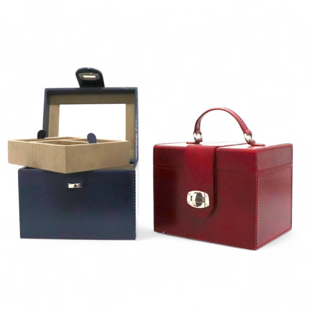 Two jewelry boxes, one red and one blue with a beige interior, on a white background.