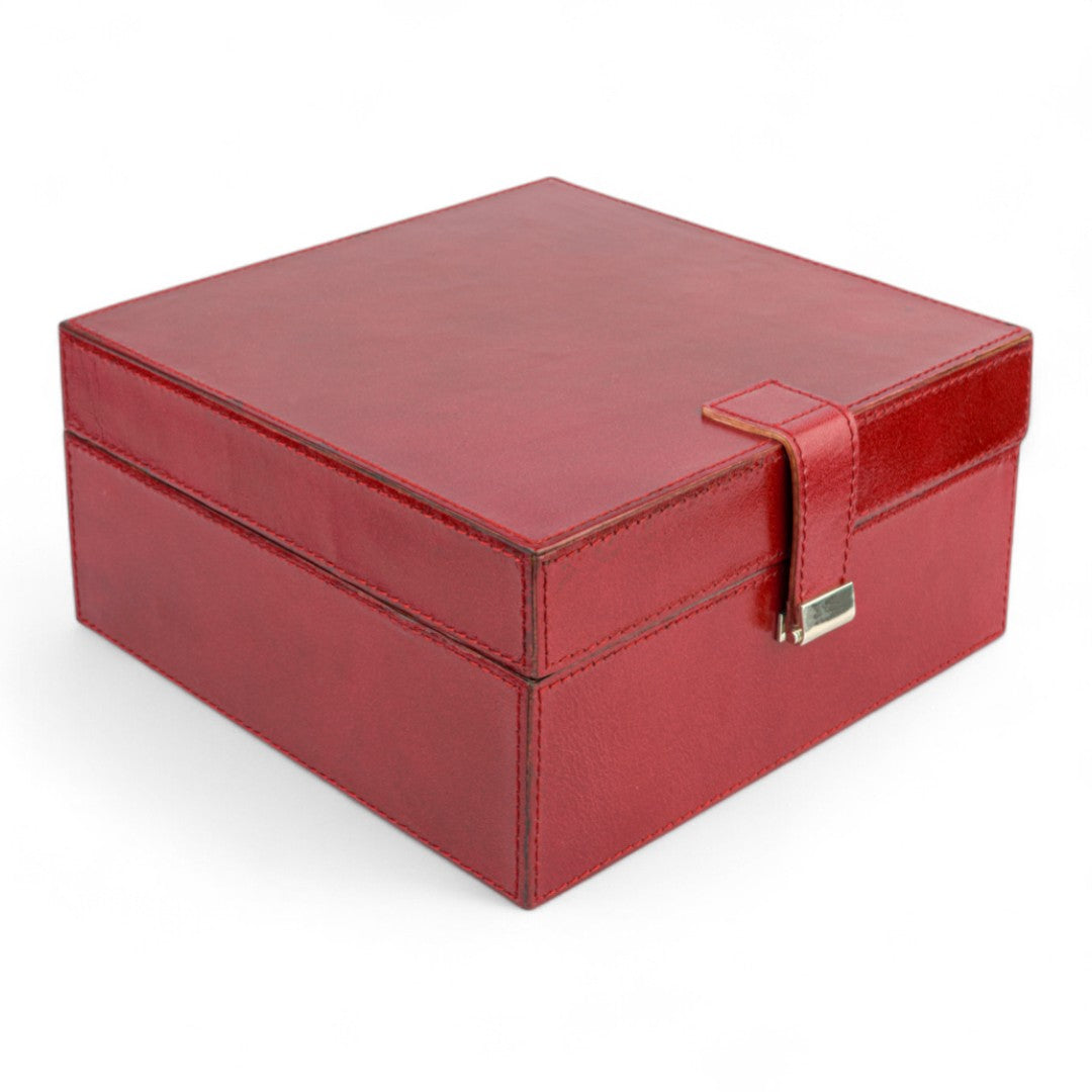 Red jewelry box with a gold clasp on a white background