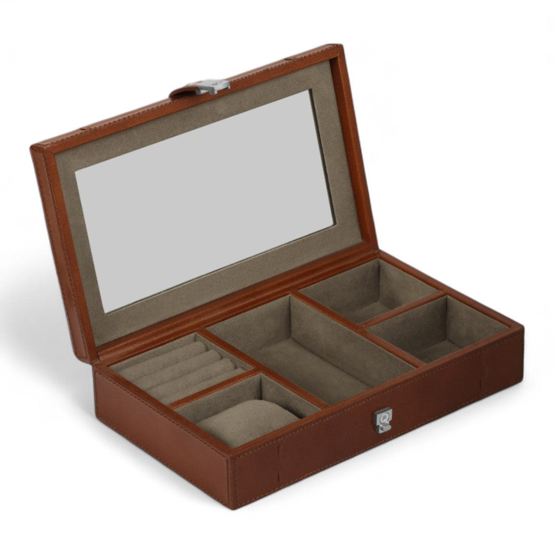 Brown jewelry box with glass lid on a white background