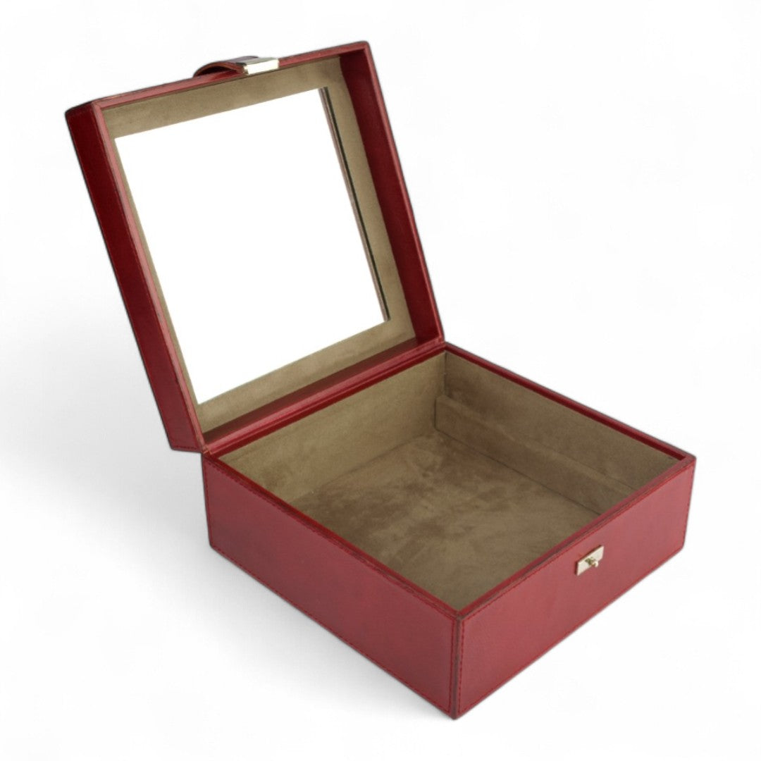 Red jewelry box with a glass lid on a white background