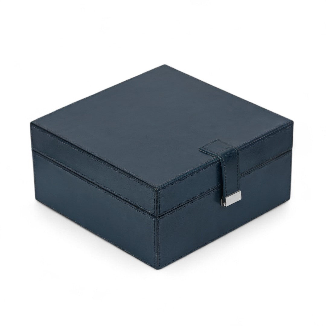 Navy blue jewelry box with a silver clasp on a white background