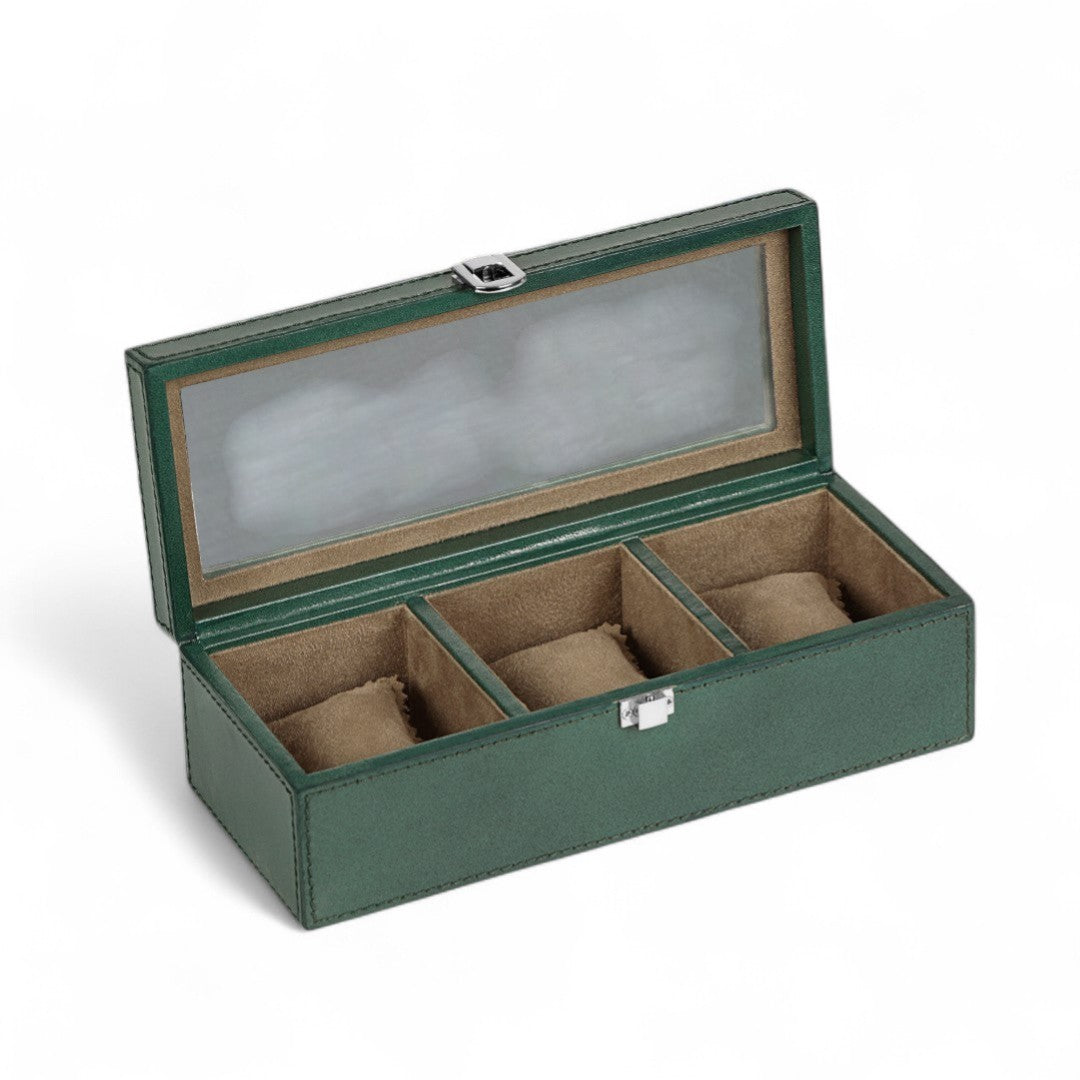 Green leather watch box with four compartments on a white background
