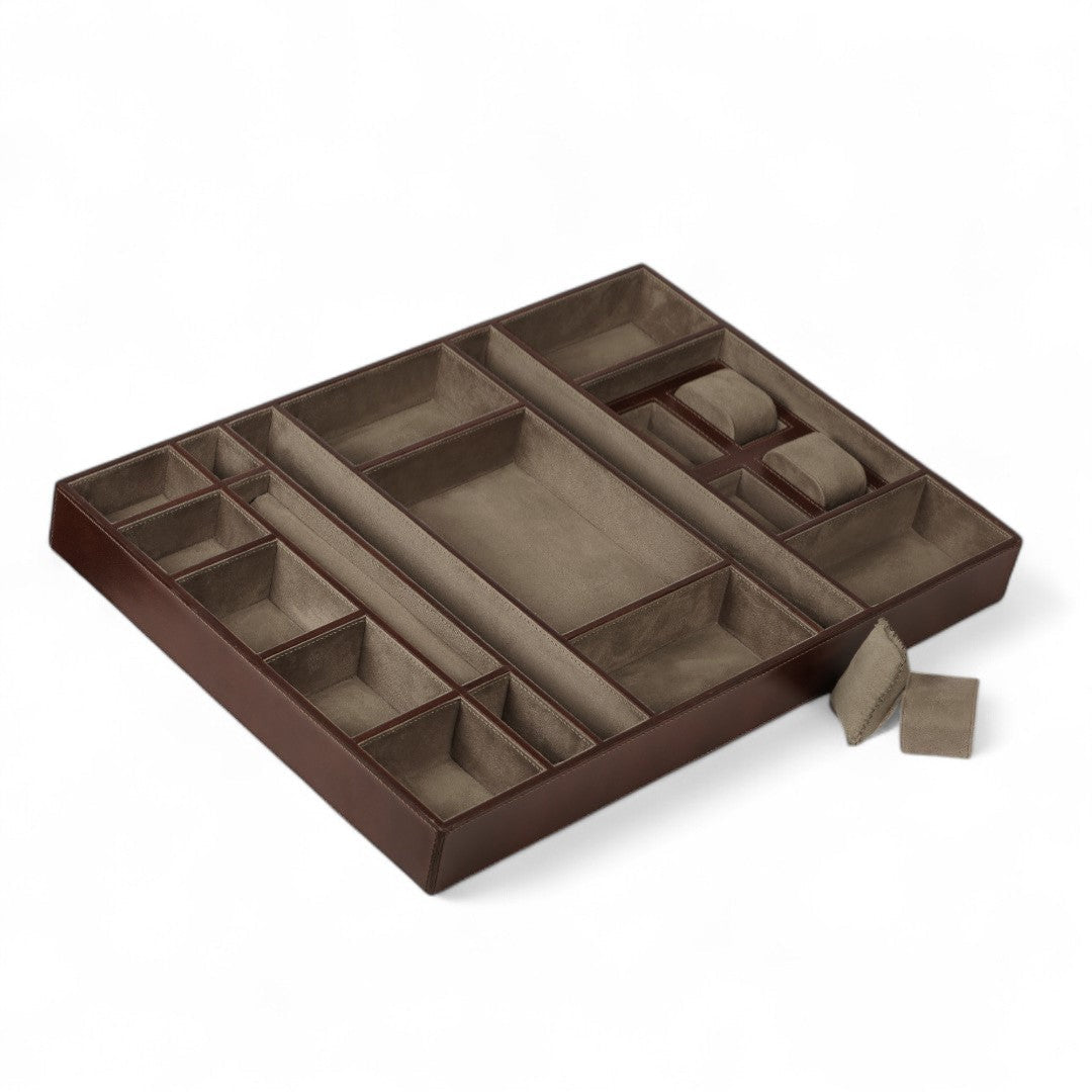 Brown jewelry organizer with compartments on a white background