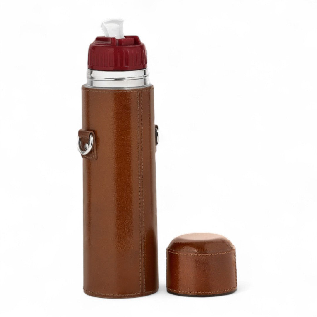 Brown leather case with a silver clip and red top on a white background