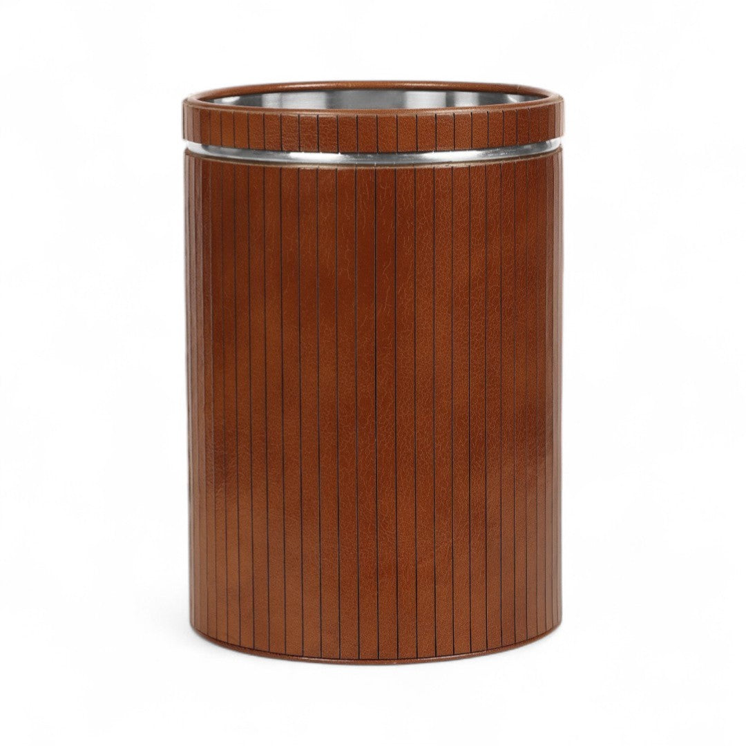 Brown cylindrical trash can with a silver rim on a white background