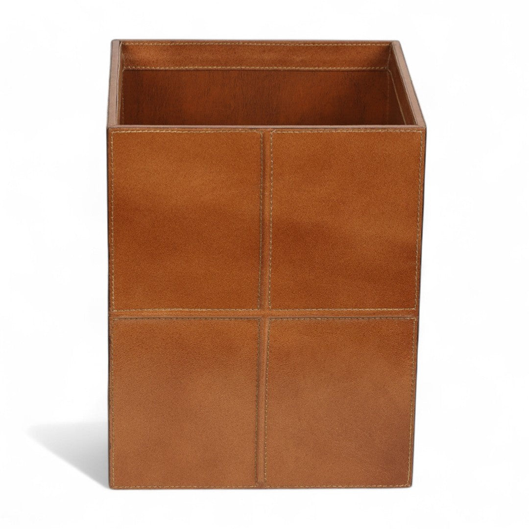 Brown leather wastebasket on a white background