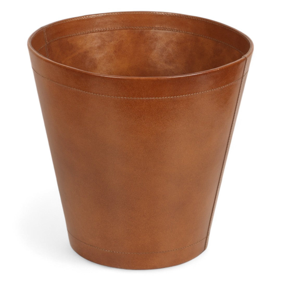 Brown leather wastebasket on a white background