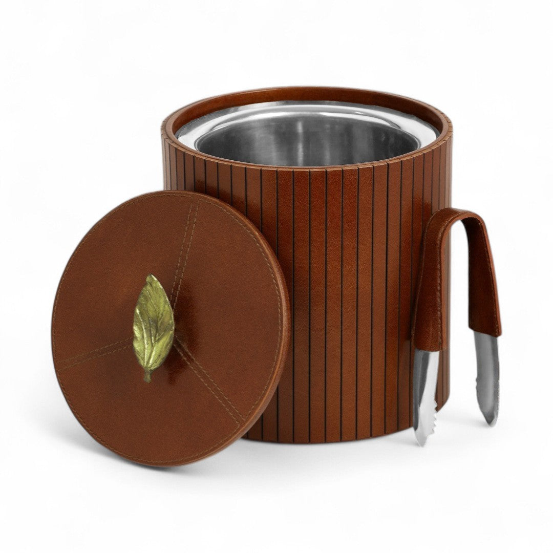 Brown ribbed container with lid and utensils on a white background