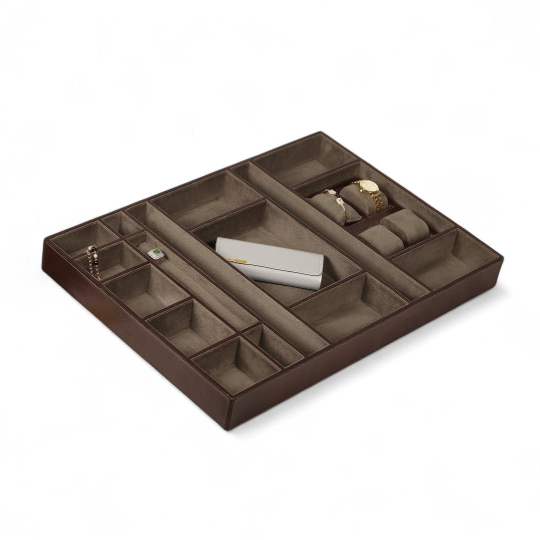 Brown jewelry organizer with compartments on a white background