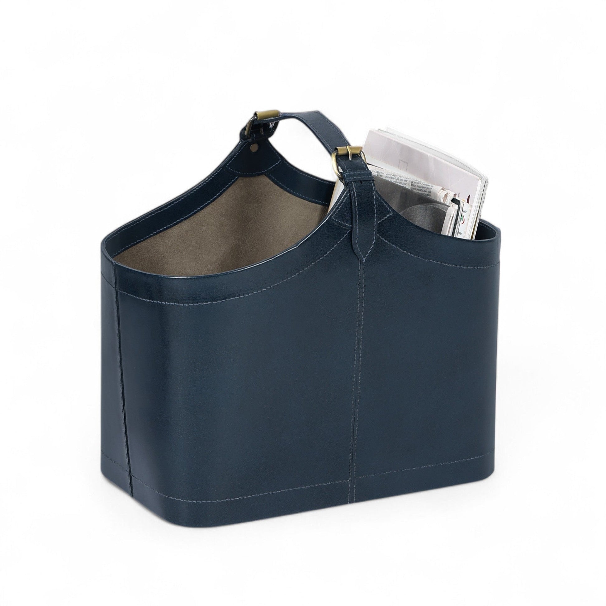 Navy blue tote bag with a handle, partially filled with books on a white background