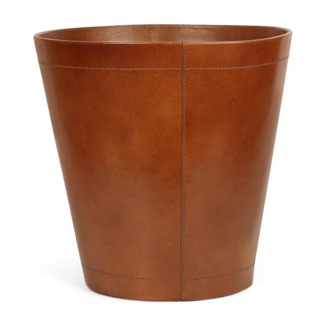 Brown leather waste bin on a white background
