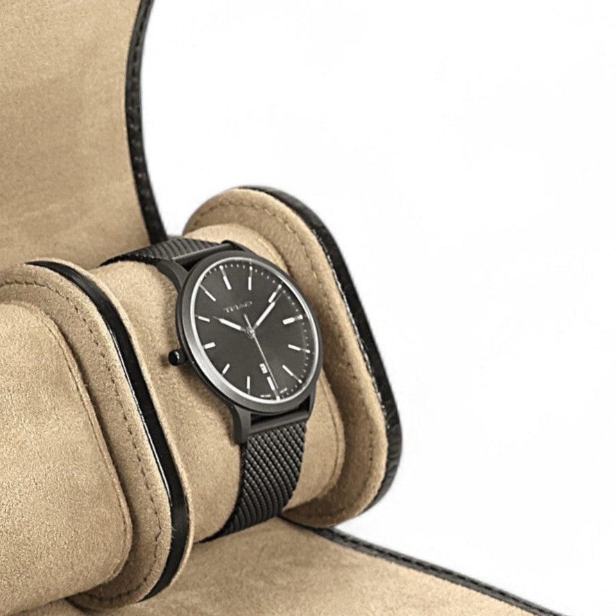 Beige watch roll with a black watch on a white background