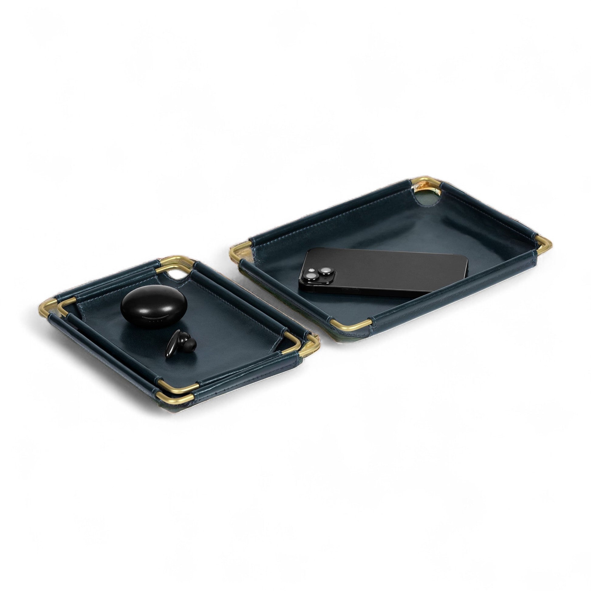 Two dark blue trays with gold accents on a white background