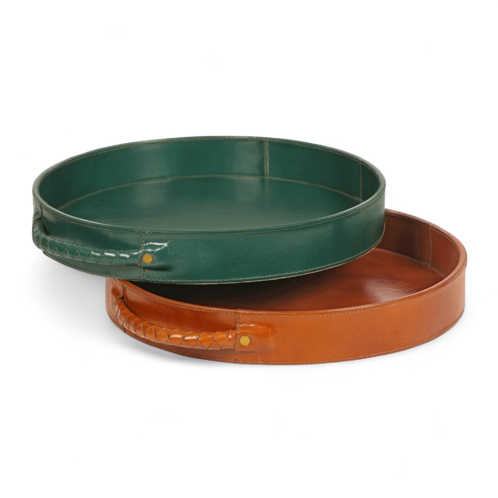 Two round trays, one green and one brown, on a white background