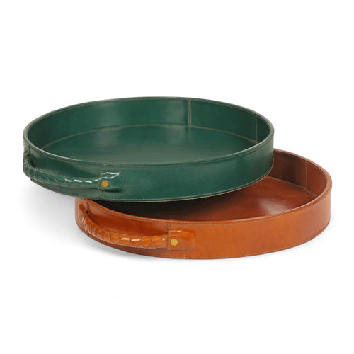 Two round trays, one green and one brown, on a white background