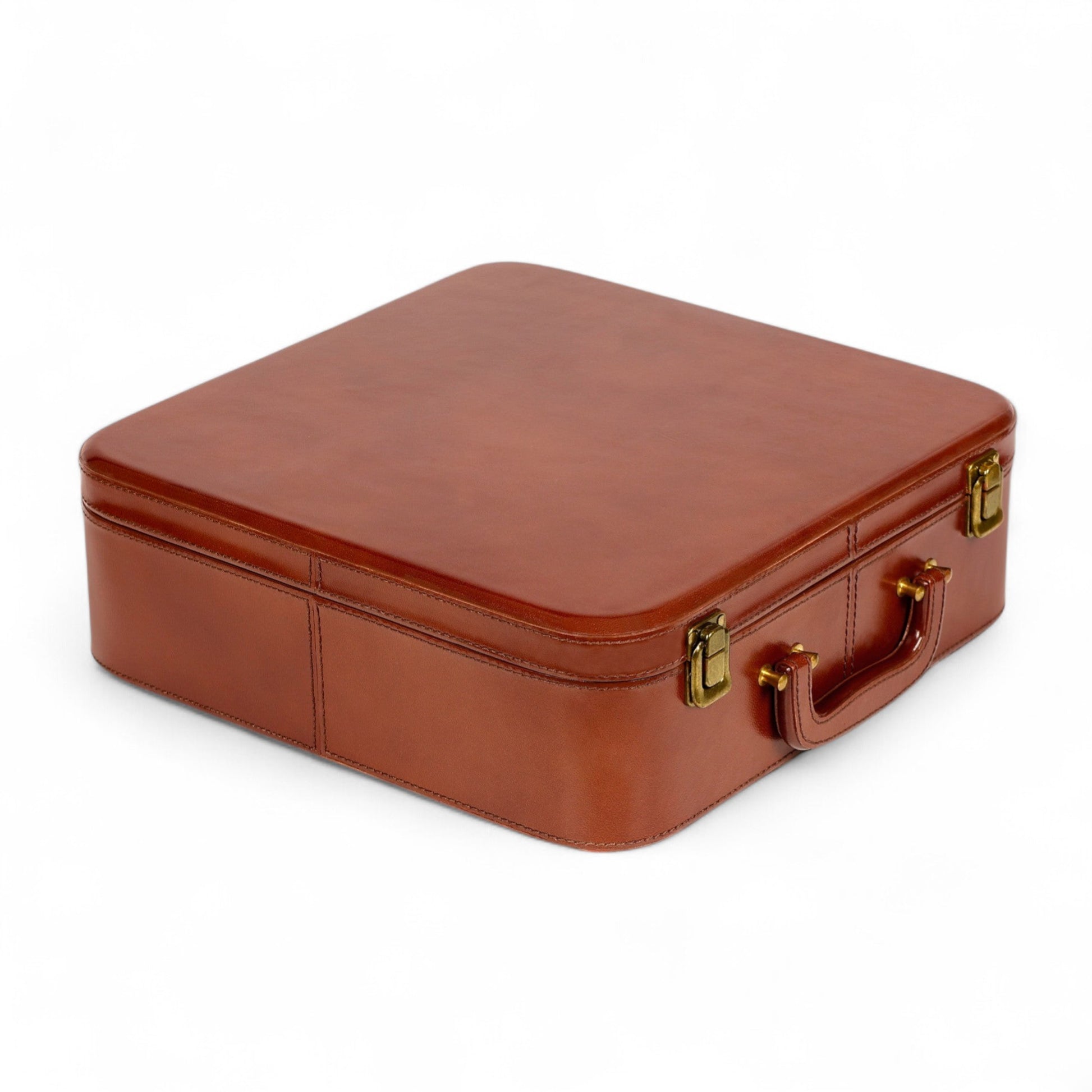 Brown leather suitcase with gold hardware on a white background