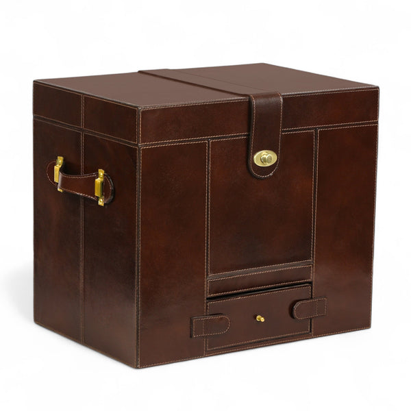 Brown leather storage trunk with a handle and lock on a white background