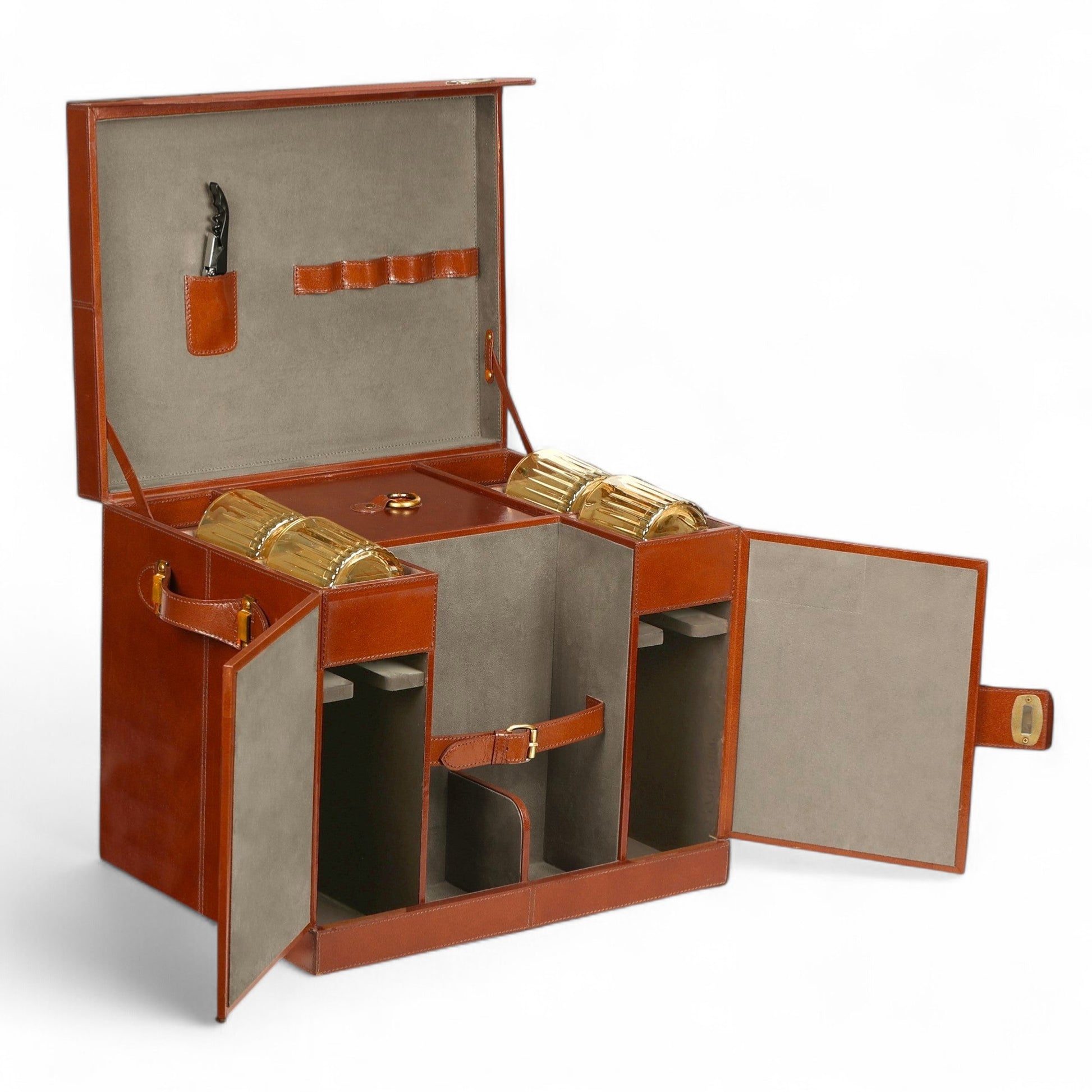 Open brown leather jewelry box with gold jewelry on a white background
