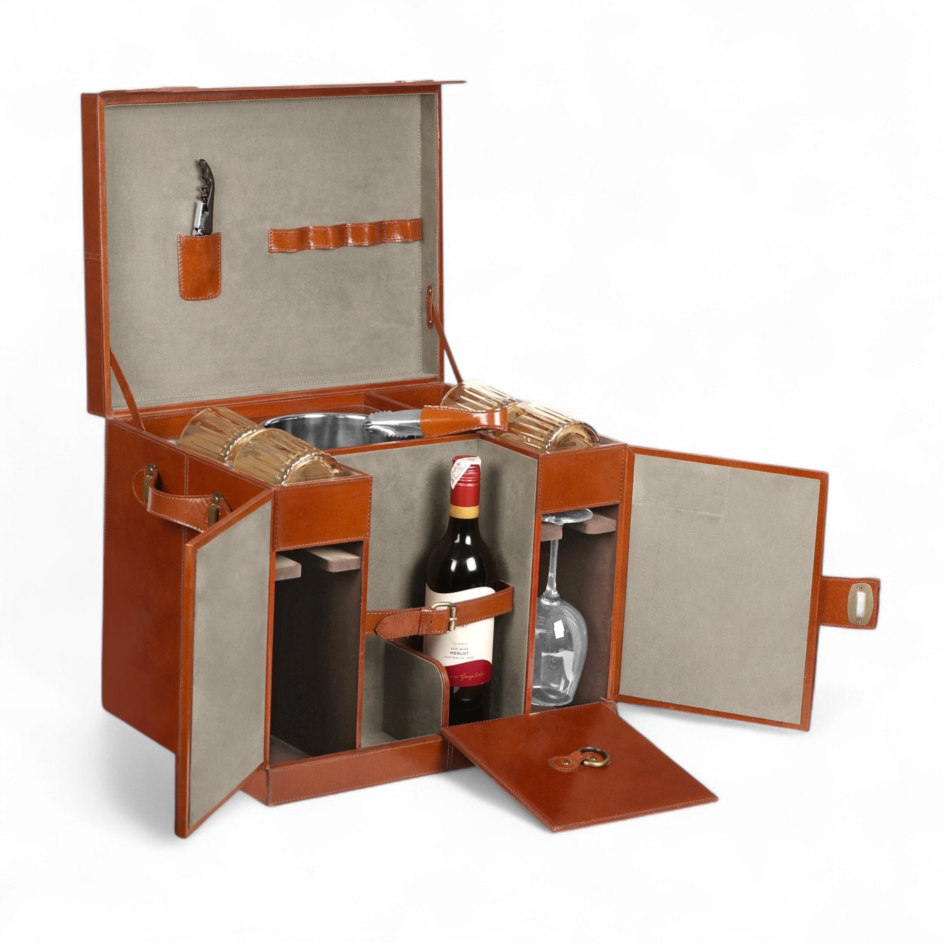Wine set with a bottle, glasses, and accessories in an open brown leather case on a white background