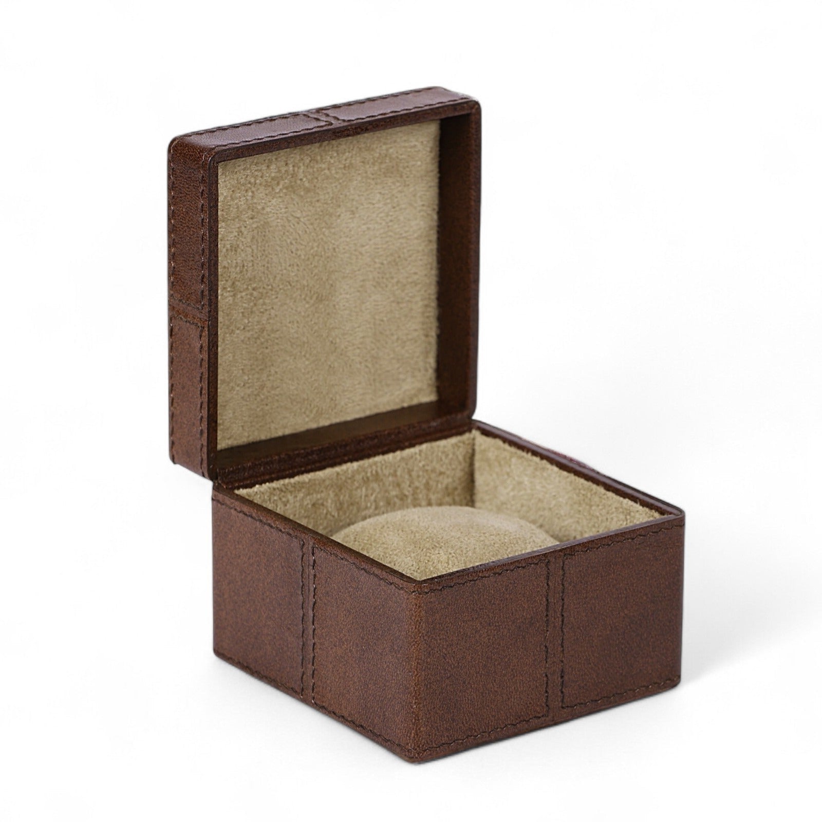 Brown jewelry box with beige interior on a white background